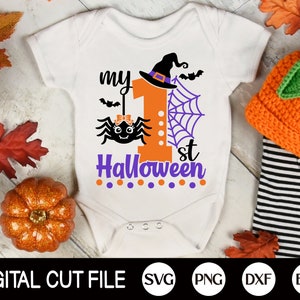 May include: White onesie with a purple and orange graphic of a spider, a witch's hat, and the text "my 1st Halloween".