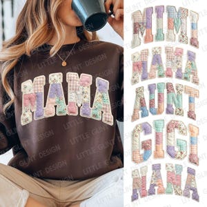 May include: A brown sweatshirt with the word "MAMA" in patchwork letters. The letters are made of various floral and patterned fabrics in pastel colors. Additional patchwork letters spell "MIMI", "AUNT", "GIGI", and "NANA".