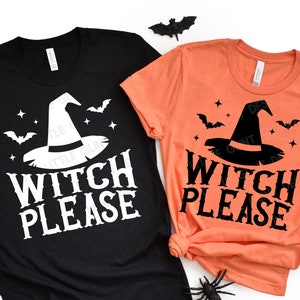May include: Two t-shirts with a witch hat and the text "Witch Please" on them. One shirt is black with white text and the other is orange with black text.