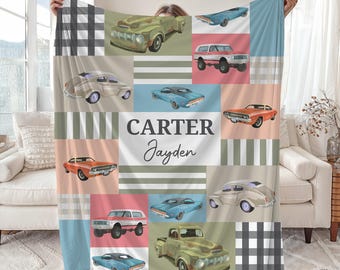 May include: A blue, green, and red personalized blanket with a checkered pattern and a variety of vintage cars. The blanket has the names "Carter" and "Jayden" printed on it.