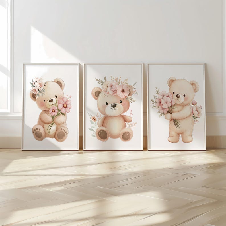 May include: Three framed watercolor prints featuring adorable teddy bears. Each bear is depicted in soft, pastel colors, adorned with floral accents, and holding or wearing flowers. The artwork is set against a white background, creating a charming and whimsical aesthetic.