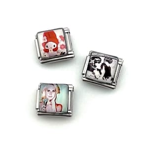 May include: Three silver charm bracelets with different images. One charm features a cartoon character in a red bonnet, another shows a black and white image of two people, and the last one has a woman holding a microphone.