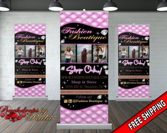 May include: A pink and black retractable banner with a diamond pattern and the text "Fashion Boutique" in gold lettering. The banner also includes the text "Shop Online!" and the website address "www.fashionboutique.com".