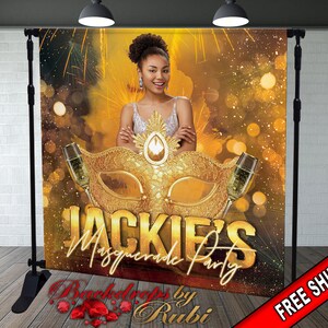 May include: A gold and black masquerade party backdrop with a gold mask, champagne flutes, and the text "Jackie's Masquerade Party".