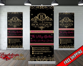 May include: A black and gold retractable banner with the text "The Vintage Boutique" and a gold ornate letter "B". The banner also includes the website address "WWW.TheVintageBoutique.com" and the tagline "Beauty - Handbags - Jewelry".