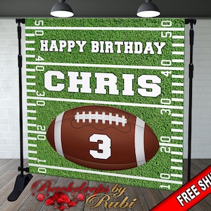 May include: Green and white football field backdrop with the words "Happy Birthday Chris" and a football with the number "3" on it.