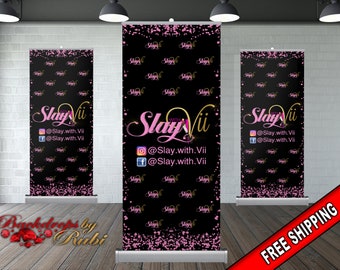May include: Three black backdrop banners with pink glitter and the text "SlayVii" in pink and gold lettering. The text "@Slay.with.Vii" and "@Slay.with.Vii" are also included on the banners.