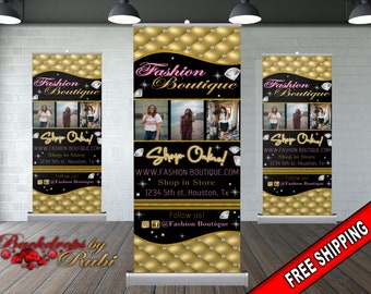 May include: A black and gold retractable banner with the text "Fashion Boutique" in a pink and gold script font. The banner features a quilted background with gold buttons and diamond accents. The text "Shop Online!" is in a yellow script font with diamond accents. The banner also includes the website address "www.fashionboutique.com", the address "1234 5th st, Houston, Tx", and the social media handles "@Fashion Boutique".