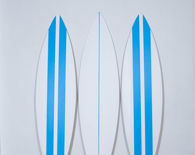 Vibrantly painted in white surfboards for coastal-inspired homes