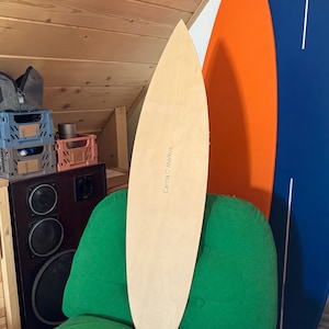 Blank Canvas: Clear Unpainted Wooden Surfboard for DIY Projects Wall decor art