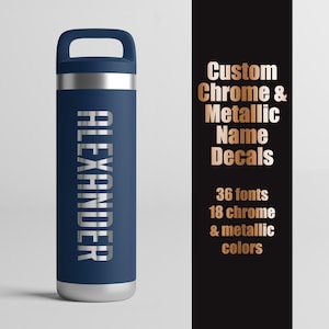 May include: A navy blue water bottle with a handle on the lid and the name ALEXANDER in silver lettering. To the right, black text reads: Custom Chrome & Metallic Name Decals, 36 fonts, 18 chrome & metallic colors in rose gold lettering.