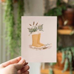 Carte de souhaits avec Illustration de bottes de pluie et fleurs jardinage printemps fete des mères