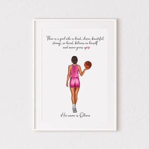 May include: A framed print featuring an illustration of a person from behind wearing a pink basketball uniform and holding a basketball. The text reads: There is a girl who is kind, clever, beautiful, strong, so loved, believes in herself and never gives up. Her name is Olivia.