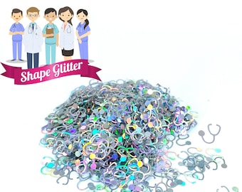 May include: A pile of iridescent silver glitter shaped like stethoscopes. The glitter is scattered on a white surface. The image includes the text "Shape Glitter".