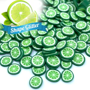 May include: A large pile of green lime slice shaped glitter. The glitter is perfect for adding a touch of summer to crafts and projects.
