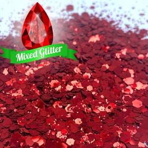 May include: A close-up of red glitter, with a red teardrop-shaped gem and a green ribbon with the text "Mixed Glitter" on it.