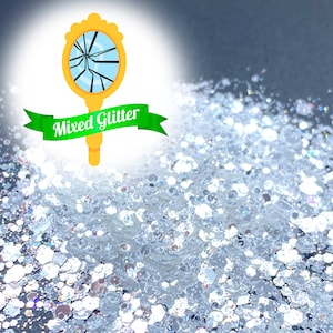 May include: A close-up of a pile of iridescent silver glitter. The glitter is a mix of different sizes and shapes, and it has a sparkly, reflective finish. The glitter is perfect for crafting, decorating, and adding a touch of sparkle to any project.