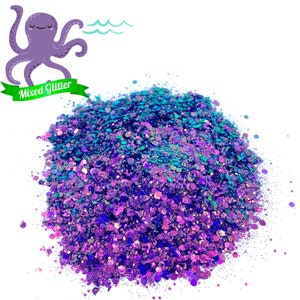 May include: A pile of iridescent purple and teal glitter, with a variety of sizes and shapes. The glitter is perfect for crafting and adding sparkle to projects.