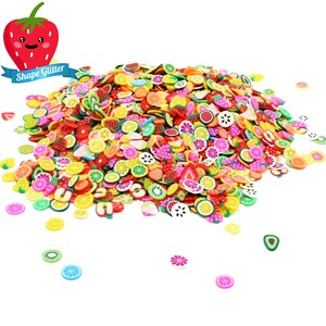 May include: A large pile of colorful fruit-shaped polymer clay charms. The charms are in the shapes of strawberries, lemons, limes, kiwi, watermelon, and oranges. The charms are perfect for adding a touch of whimsy to crafts and projects.
