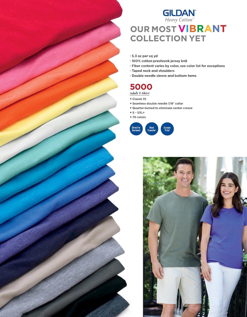 May include: A stack of 5000 Gildan Heavy Cotton T-shirts in various colors. The text "Our Most Vibrant Collection Yet" is displayed above the stack of shirts. The text "5000" is displayed above the text "Adult T-Shirt". The text "Classic fit" is displayed below the text "Adult T-Shirt". The text "Seamless double needle 7/8" collar" is displayed below the text "Classic fit". The text "Quarter-turned to eliminate center crease" is displayed below the text "Seamless double needle 7/8" collar". The text "S-5XL+" is displayed below the text "Quarter-turned to eliminate center crease". The text "70 colors" is displayed below the text "S-5XL+".