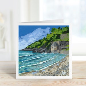 May include: A square greeting card featuring an impressionistic painting of a coastal scene. The artwork depicts a building on a rocky cliff, with a beach and ocean in the foreground. The sky is blue with white brushstrokes.
