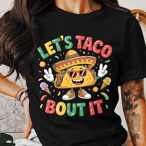 May include: Black t-shirt with a cartoon taco wearing a sombrero and sunglasses. The text "Let's Taco Bout It" is printed on the shirt.