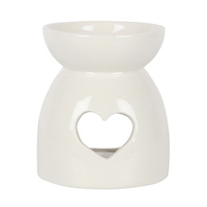 May include: White ceramic wax melt burner with a heart-shaped cutout.