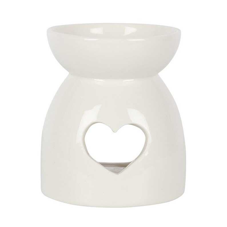 May include: White ceramic wax melt burner with a heart-shaped cutout.