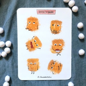 May include: A sheet of stickers featuring six different illustrations of a cartoon character with a fluffy, orange body. The character has different facial expressions and poses. The stickers are labeled "Doodle ♥ Bubz" and "@strawbebestudios".
