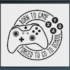 May include: Black and white illustration of a video game controller with the text "Born to Game Forced to Go to School" around it.