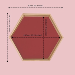 May include: Hexagonal tray with a red interior and a natural wood frame. The tray measures 30cm (12 inches) across, 26cm (10 inches) high, and 26.5cm (10.2 inches) wide. The interior is 23cm (9 inches) wide.