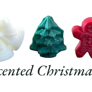 Pode incluir: Tr&ecirc;s derretes de cera em forma de &aacute;rvore de Natal, um homem de gengibre e um la&ccedil;o. Os derretes s&atilde;o verdes, vermelhos e brancos. Super Scented Christmas Melts.