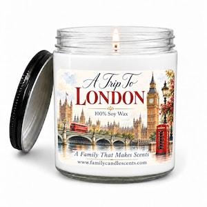 May include: A clear glass candle jar with a black lid, filled with white wax and a single wick. The label features a colourful illustration of London landmarks, including Big Ben and a red telephone box, with the text A Trip To LONDON 100% Soy Wax.