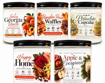 May include: Five glass jars of hand-poured soy candles from the Pet Safe Wickless Collection. Labels feature text including Juicy Georgia Peach, Pumpkin Pecan Waffles, Pistachio Cupcake, Happy Home, and Apple & Evergreen with various botanical illustrations.