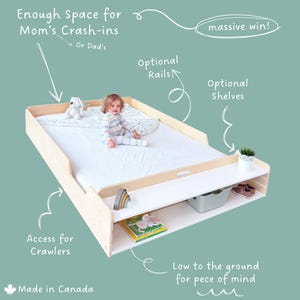 May include: A light wood-toned baby bed with a white mattress, a lower shelf, and a child sitting on the bed. The bed has the text "Enough Space for Mom's Crash-ins" and "Made in Canada".