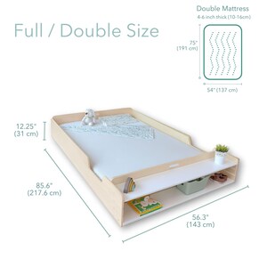 May include: A light wood-toned full/double size bed frame with a white mattress. The frame has a built-in shelf with storage. The bed is 85.6 inches (217.6 cm) long and 56.3 inches (143 cm) wide. The mattress is 75 inches (191 cm) long and 54 inches (137 cm) wide.