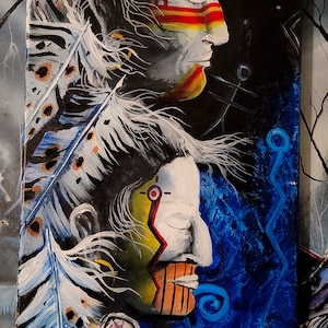May include: An acrylic painting on canvas featuring two Native American profiles in a vertical composition. The profiles are painted in white with colorful accents, set against a dark background with feathers and blue swirls.