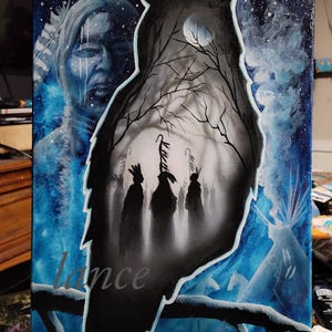 May include: A blue and white painting of an owl with a group of people standing inside the owl's silhouette. The owl is perched on a branch with a moon and stars in the background. The painting is signed "lance" in the bottom left corner.