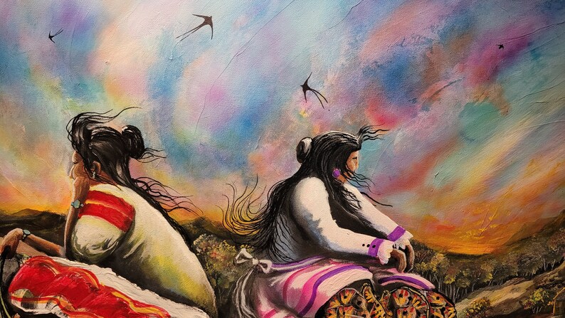 May include: Two women with long dark hair, wearing traditional clothing, sit facing a colorful sunset sky with birds flying overhead. The women are painted in a realistic style with a focus on their clothing and hair.