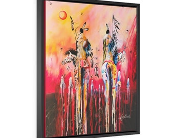 May include: A framed canvas print featuring an abstract painting of Native American figures on horseback. The artwork uses a vibrant palette of red, yellow, and orange hues, with details of the riders and horses. The painting is signed in the lower right corner.