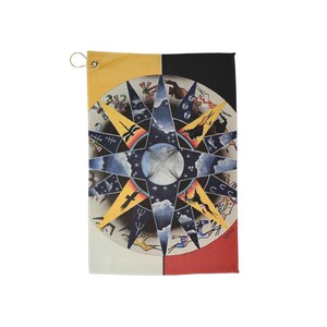 May include: A rectangular, multi-colored towel featuring a starburst design with celestial and animal imagery. The towel is divided into quadrants of yellow, black, white, and red. A metal ring is attached to the top corner for hanging.