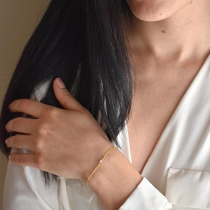 Handmade and dainty jewelry made in Montreal by Piper & Pearl Jewelry. Feminine, modern and delicate, perfect for a gift for her. Collections of costume, vermeil and fine jewelry. Dainty and delicate rectangle zirconia gold bracelet.