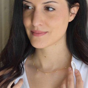 Handmade and dainty jewelry made in Montreal by Piper & Pearl Jewelry. Feminine, modern and delicate, perfect for a gift for her. Collections of costume, vermeil and fine jewelry. Geometric triangle gold necklace with cubic zirconia stones.