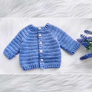 May include: A light blue crocheted baby cardigan with button closures.