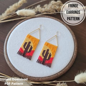 May include: A pair of beaded fringe earrings with a geometric design in shades of orange, red, and brown. The earrings are displayed on a white background with the text "FRINGE EARRINGS PATTERN" and "Instant Download PDF Pattern".