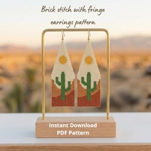 May include: A pair of handmade earrings with a desert landscape design. The earrings feature a brick stitch pattern with a cactus, sun, and fringe. The text "Brick stitch with fringe earrings pattern" and "Instant Download PDF Pattern" are visible.
