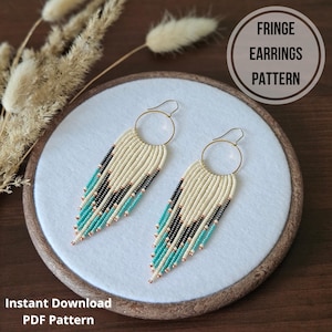 May include: Cream-coloured fringe earrings with gold hoops, accented with black and turquoise beads. The earrings are displayed on a white surface with the text "FRINGE EARRINGS PATTERN" and "Instant Download PDF Pattern".