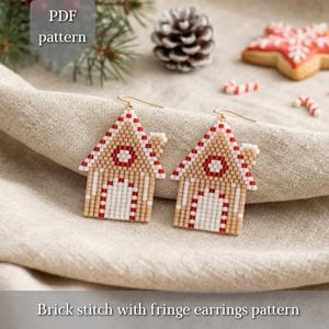 May include: A pair of beaded earrings shaped like gingerbread houses with tan, white, and red beads, featuring a brick stitch design and gold-tone ear wires. The image includes the text PDF pattern and Brick stitch with fringe earrings pattern.