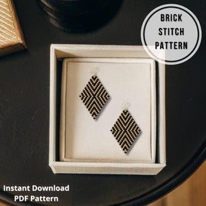 May include: A pair of black and gold beaded diamond-shaped earrings with gold-colored hooks, displayed in a white box. The earrings feature a brick stitch pattern. Text on the image reads "Brick Stitch Pattern" and "Instant Download PDF Pattern."