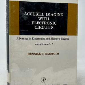 May include: A hardcover book titled "Acoustic Imaging with Electronic Circuits" by Henning F. Harmuth. The book has a white cover with black and gold accents. The publisher is Academic Press, with locations in New York, San Francisco, and London.